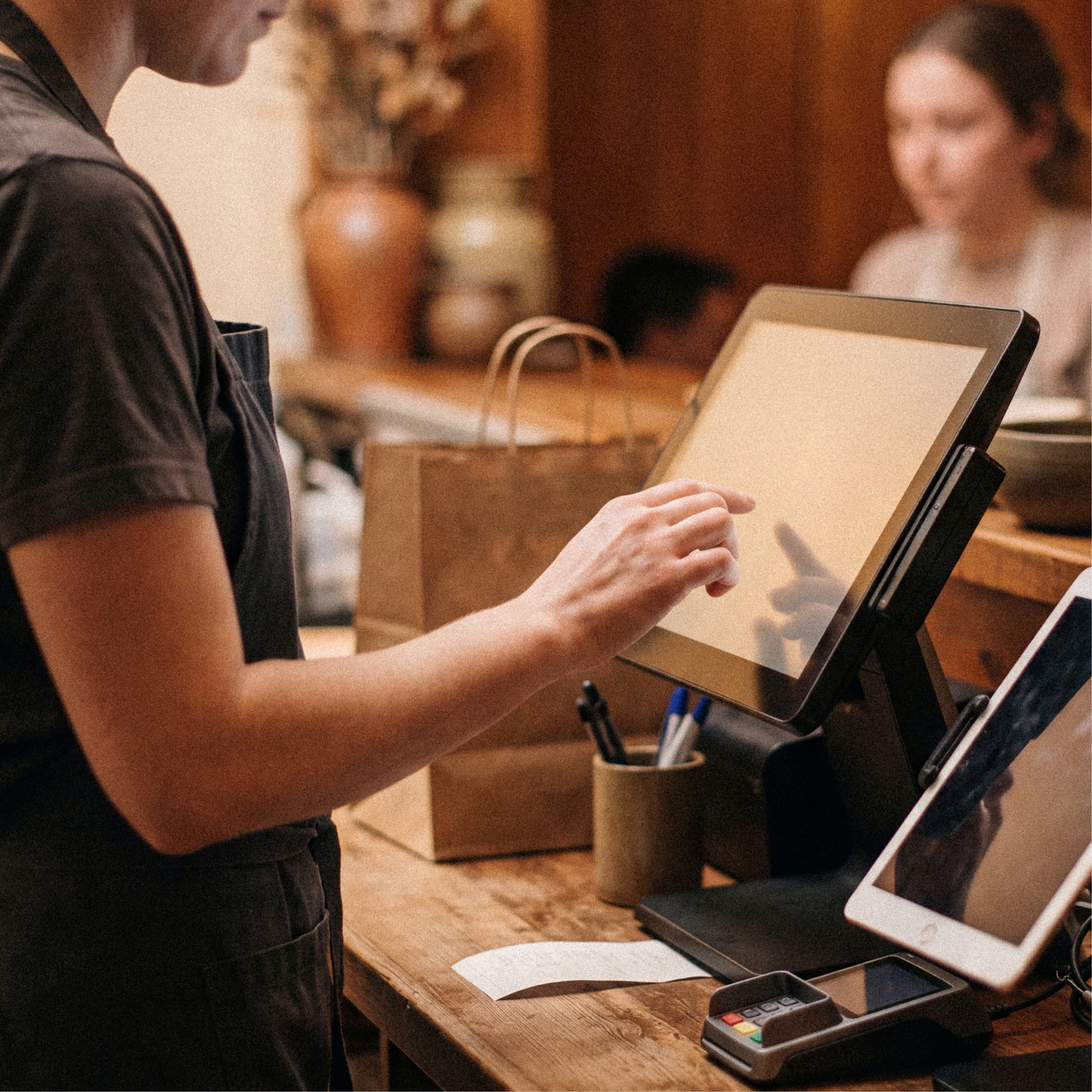 Restaurant team member taking an order on OneTablet at the counter